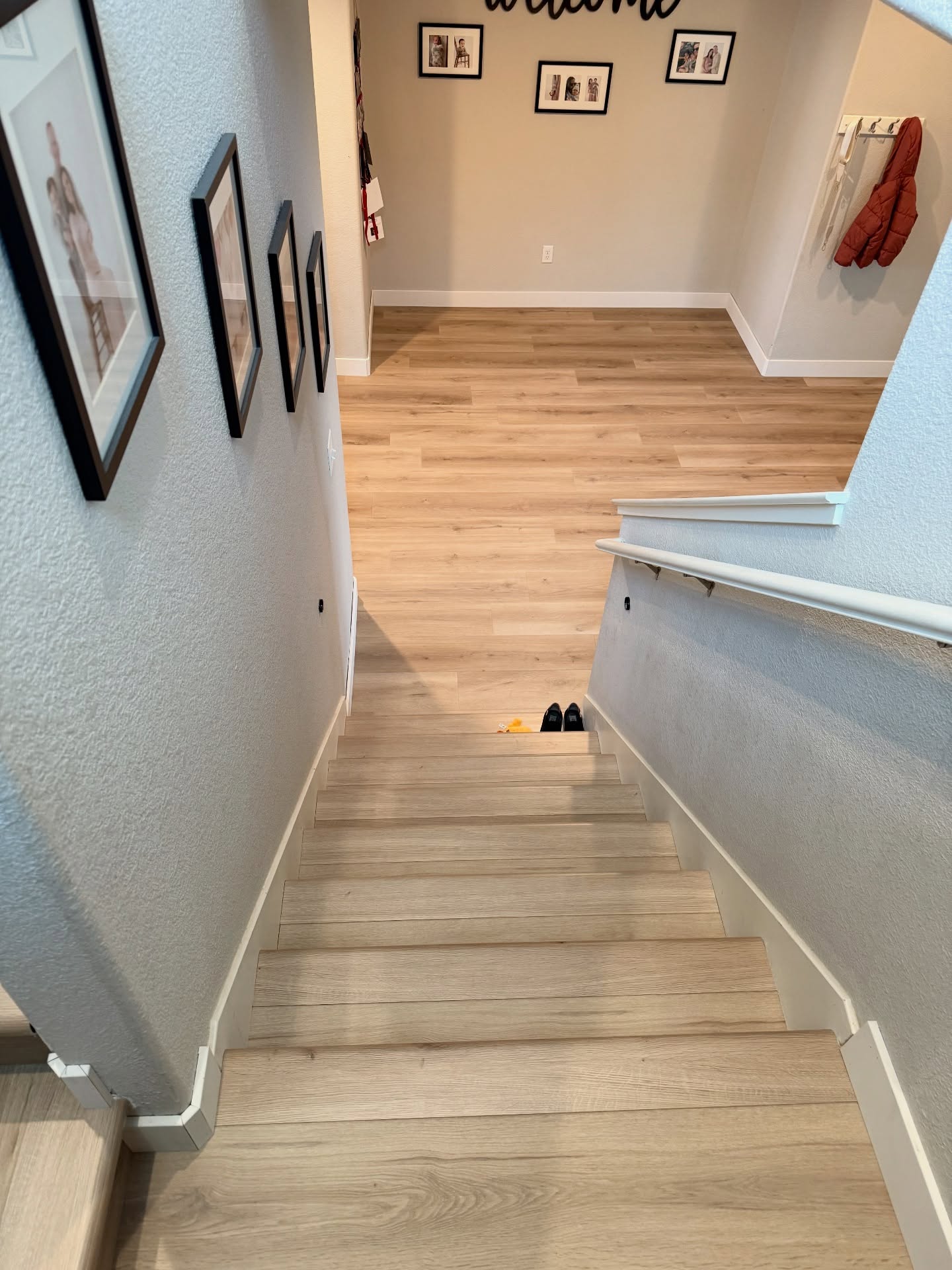 Natural oak vinyl plank stairs and landing area